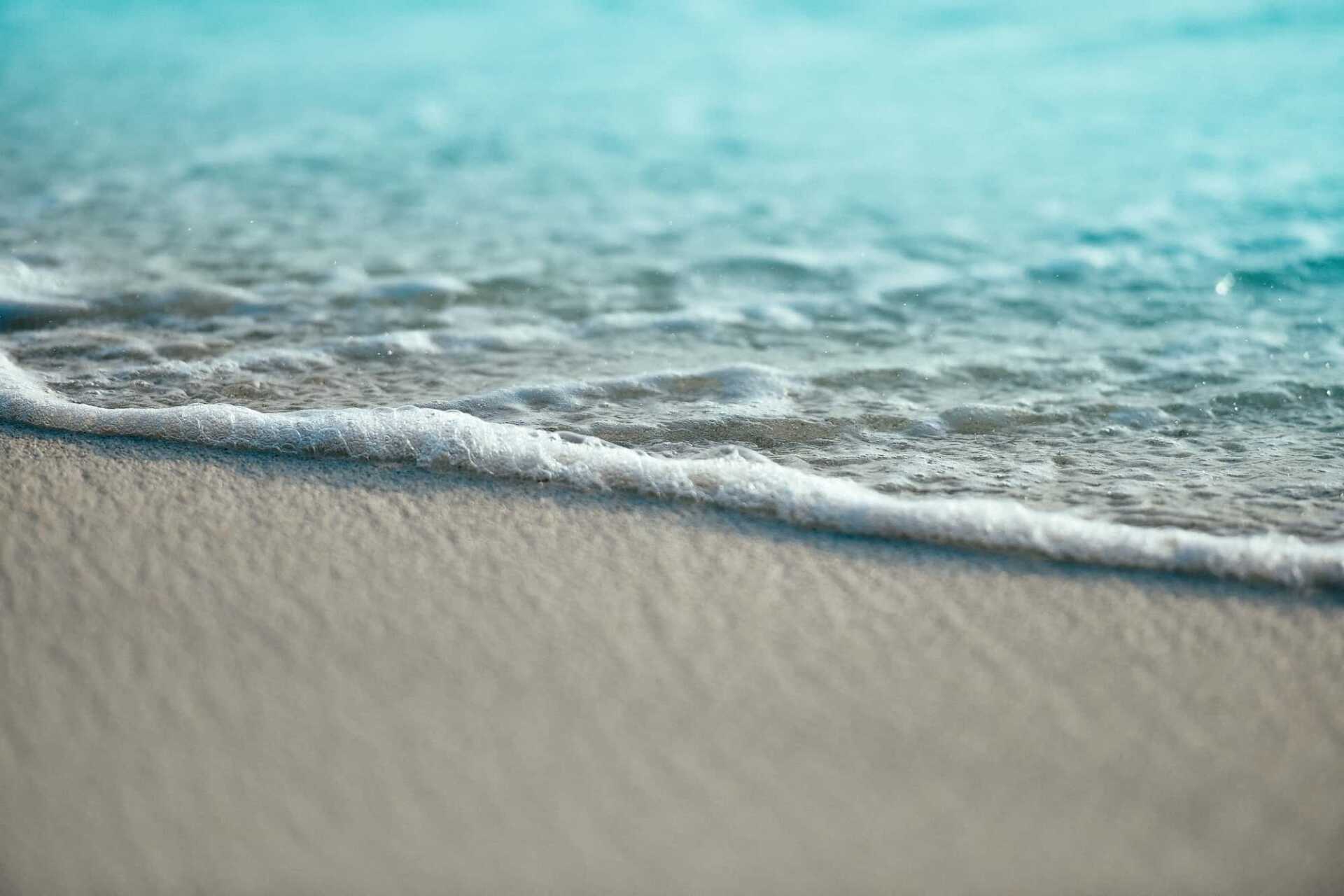 Sea washing up on sand
