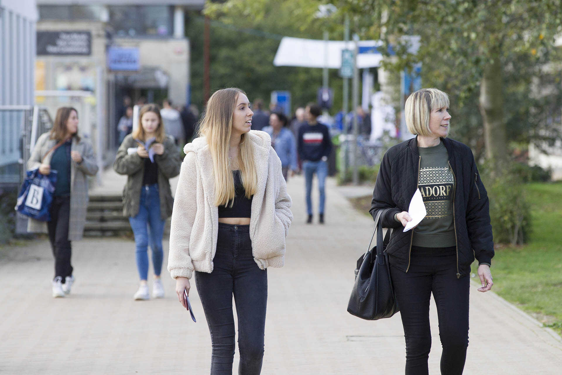 Mother and daughter walking around campus