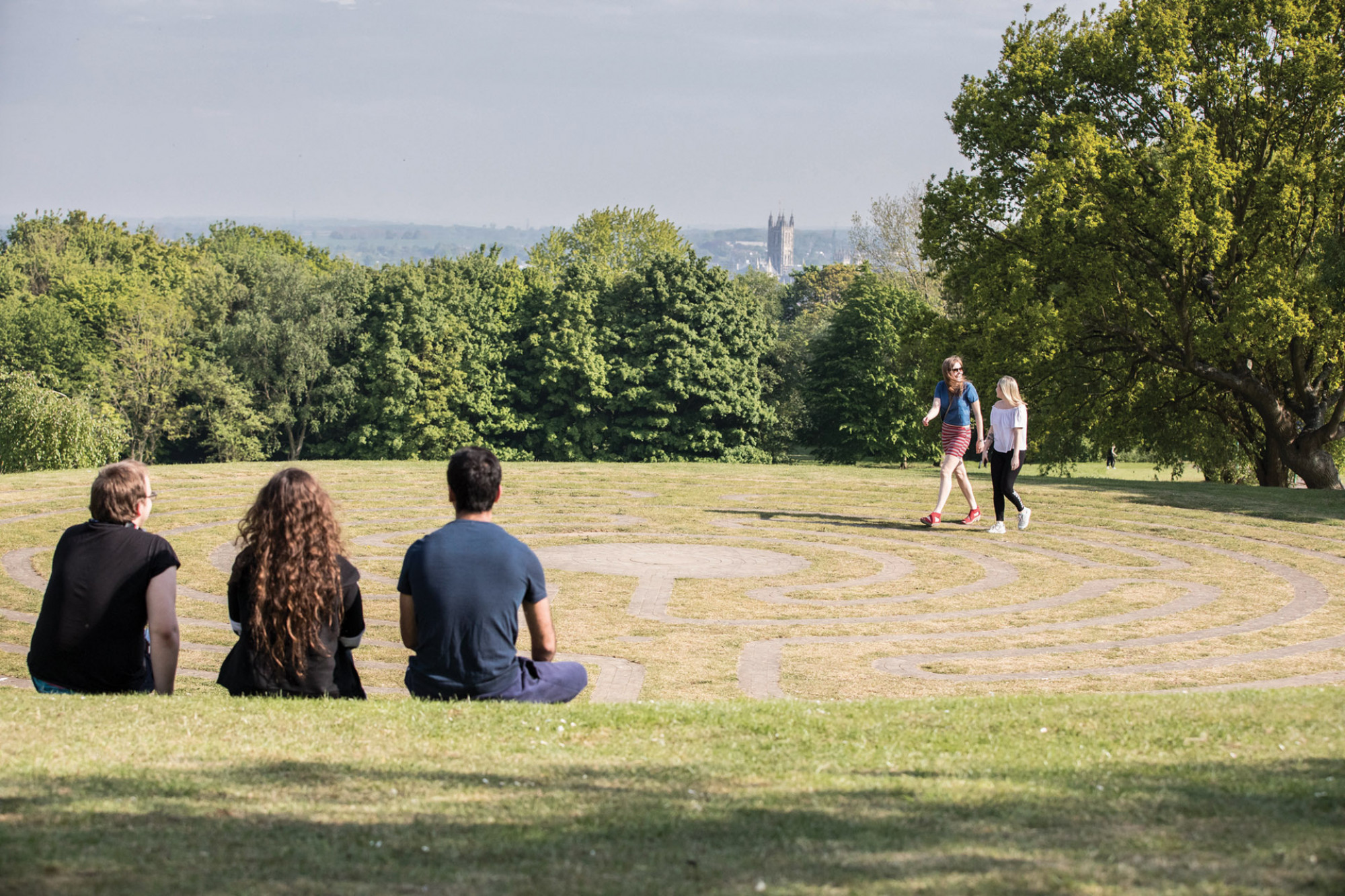 Students sat on labyrinth at Canterbury campus