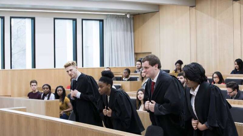Four law students mooting in the Mooting Room