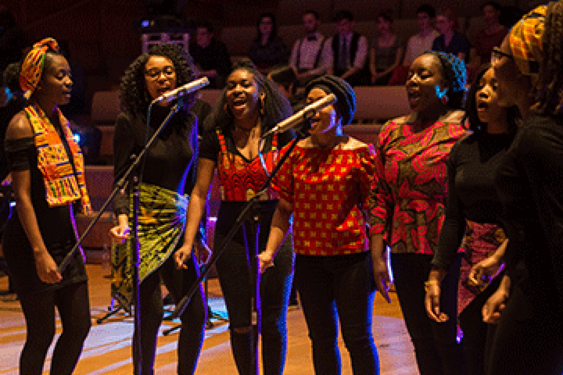Group of singers performing in a concert-hall