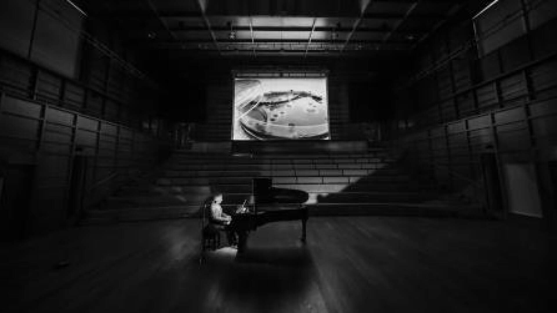 Pianist playing in a concert hall