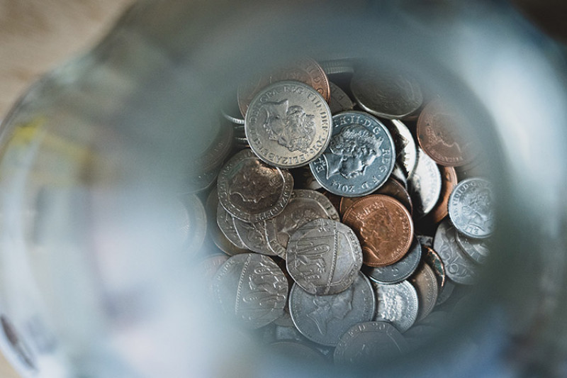 View looking down into a jar of coins