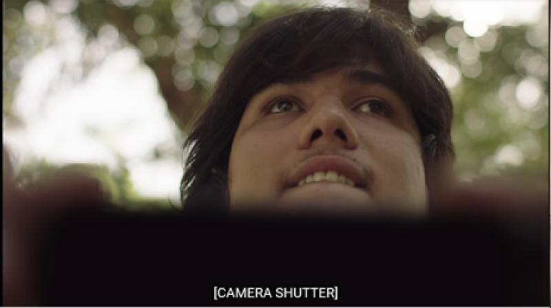 Caption information shown in square brackets [CAMERA SHUTTER] below the image in the video