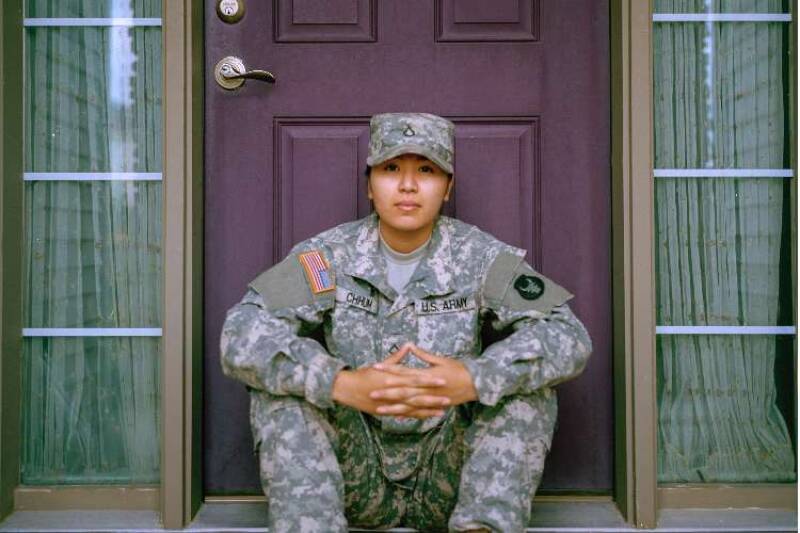 Woman sitting in front of door