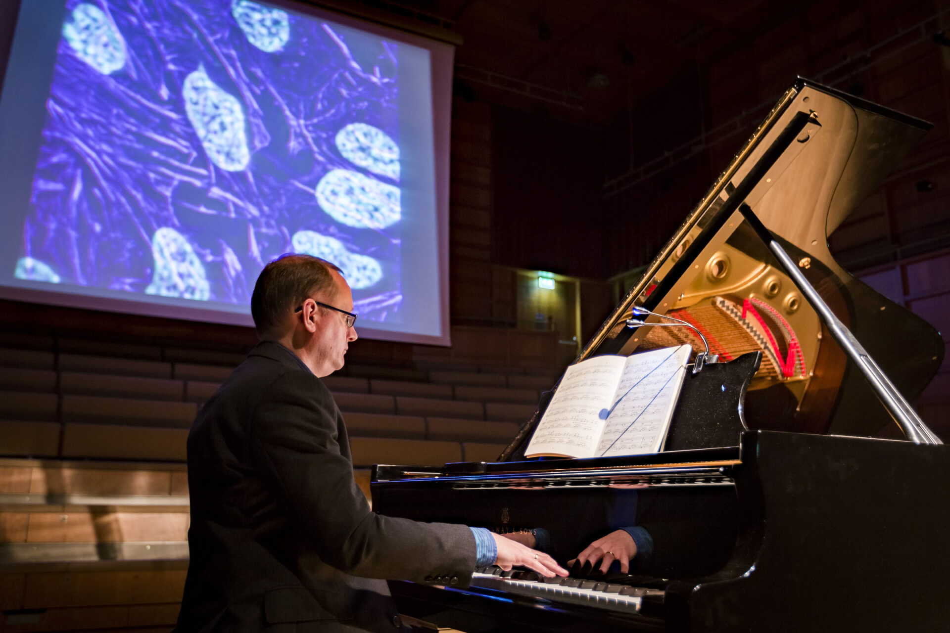 Pianist plays Grand piano