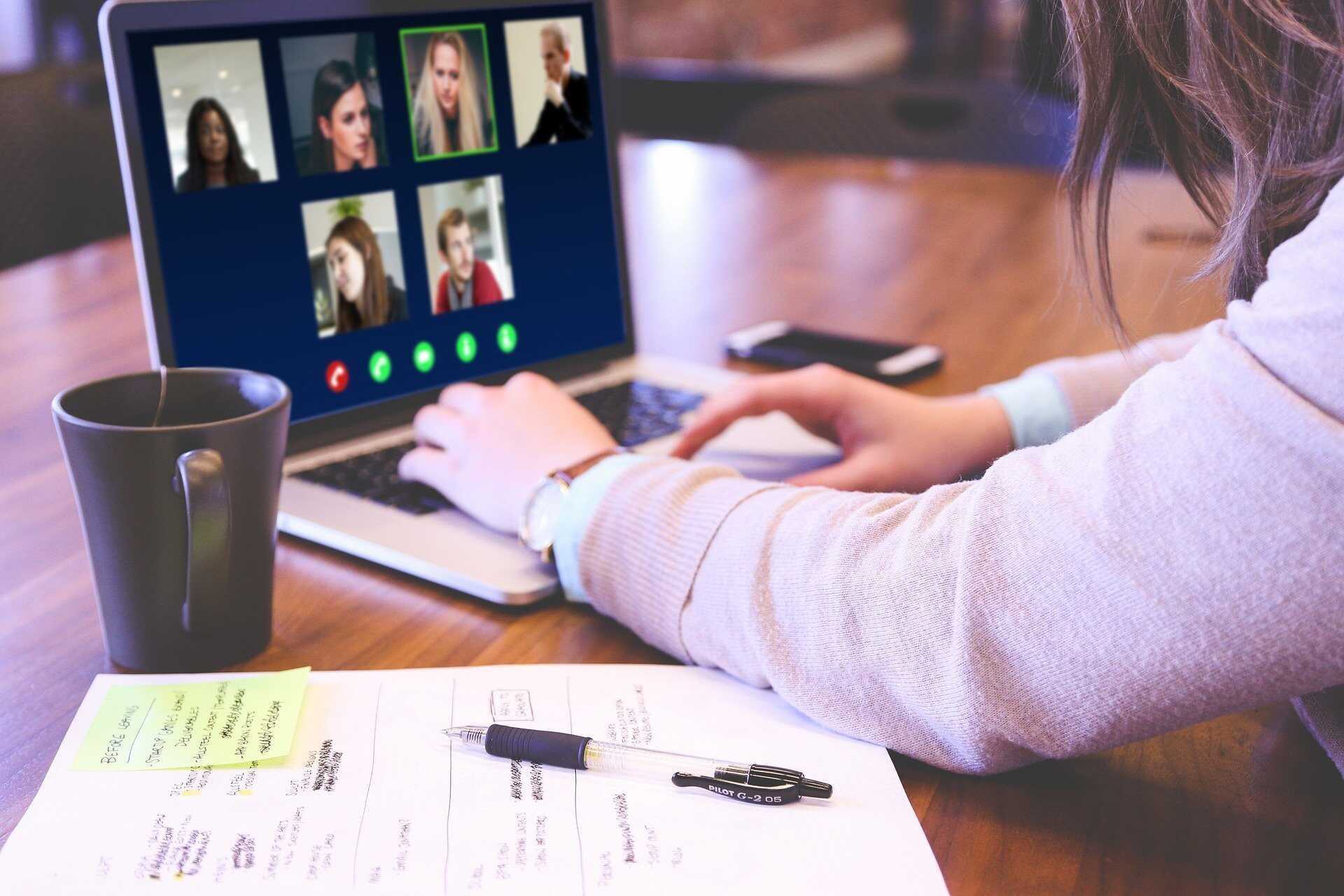 A woman in a video call on her laptop