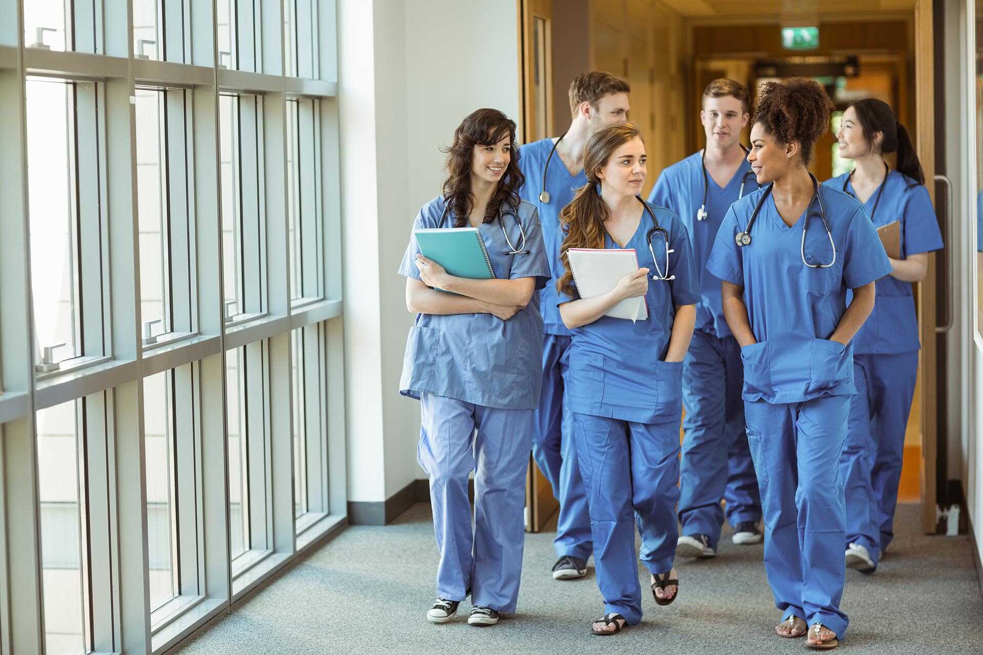 Group of medical students walking in a corridor