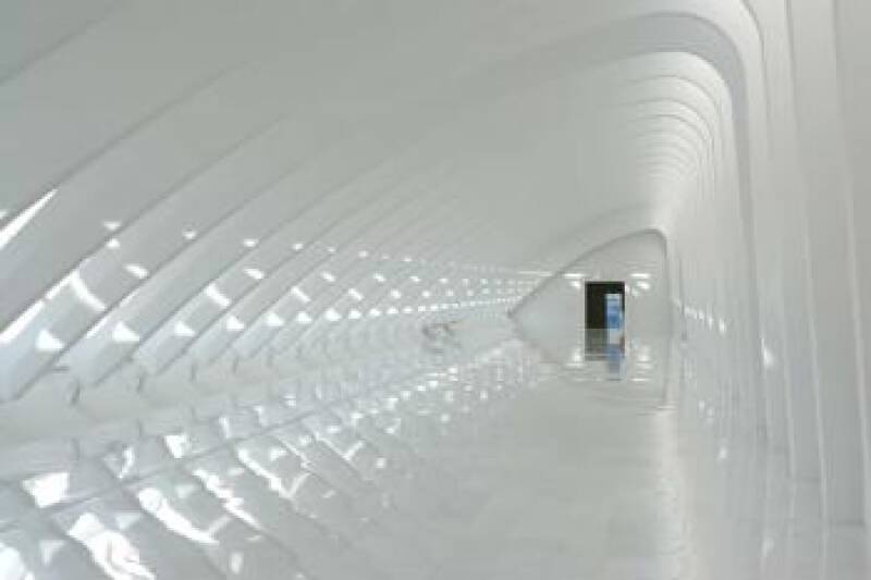 Futuristic corridor with white floors, walls and ceilings