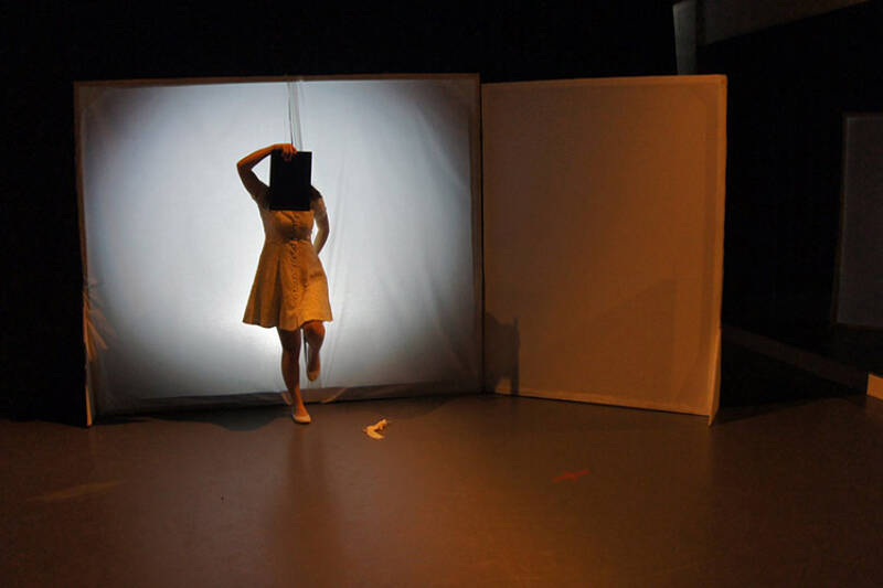 Female performer under spotlight on a stage