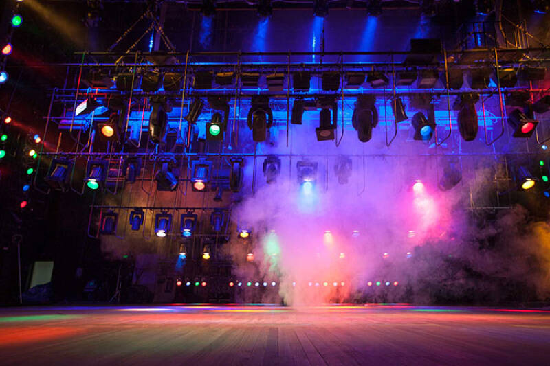 Stage with purple and pink lights and smoke