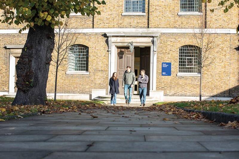 Three students walking on the Medway campus