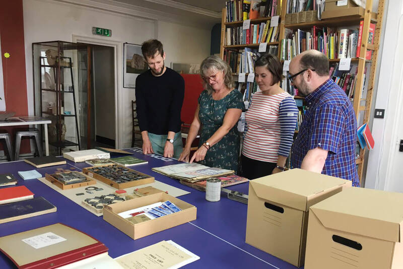 Special Collections staff examining collection materials