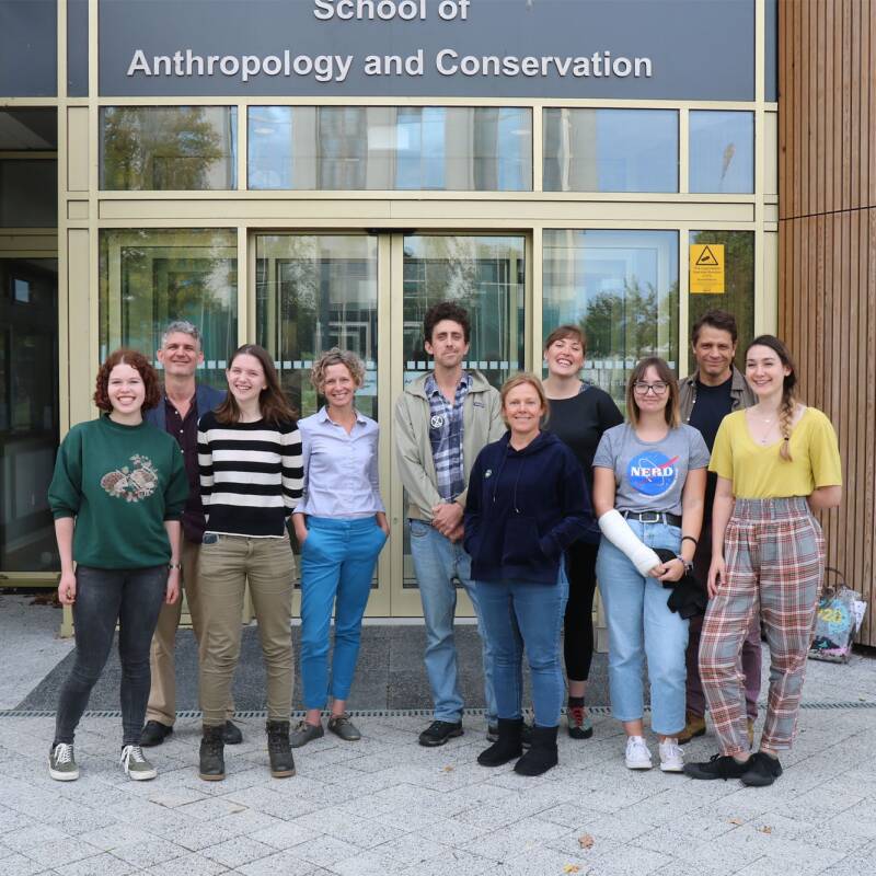 Staff and students gather outside the School of Anthropology and Conservation