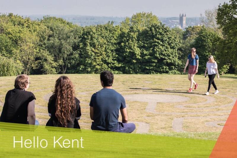 Hello Kent sample image of students sat by Canterbury labyrinth