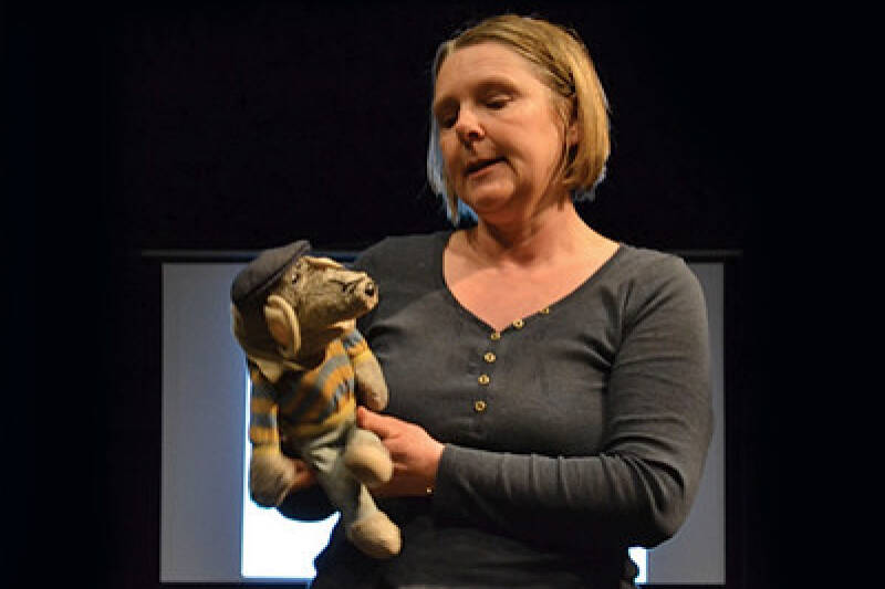 Academic on stage with hand puppet