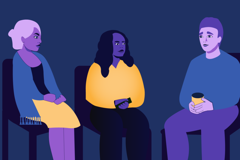 Three people sitting and talking