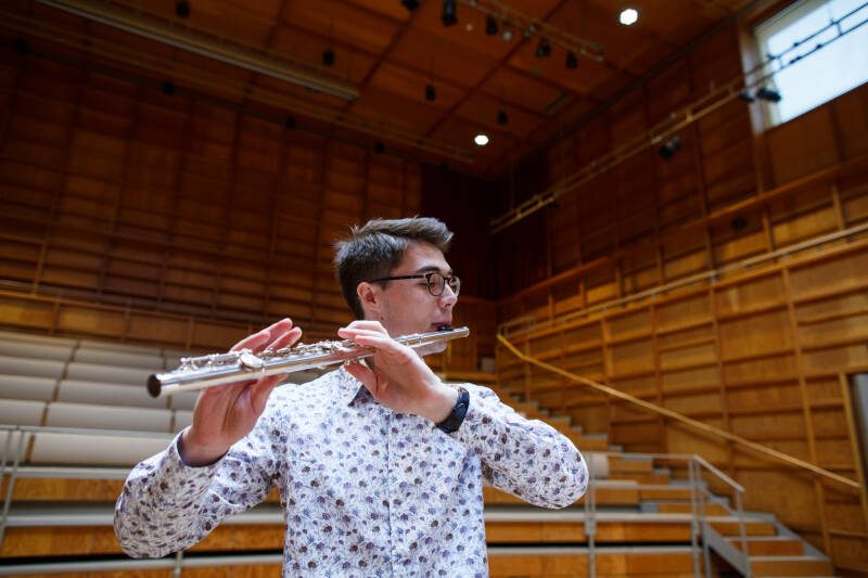 Flautist performing in Colyer-Fergusson Hall