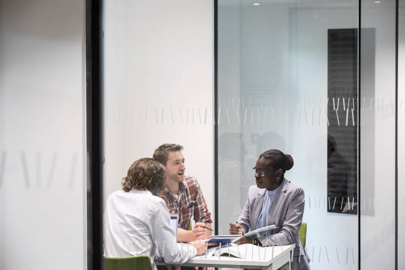 Postgraduate students in meeting room