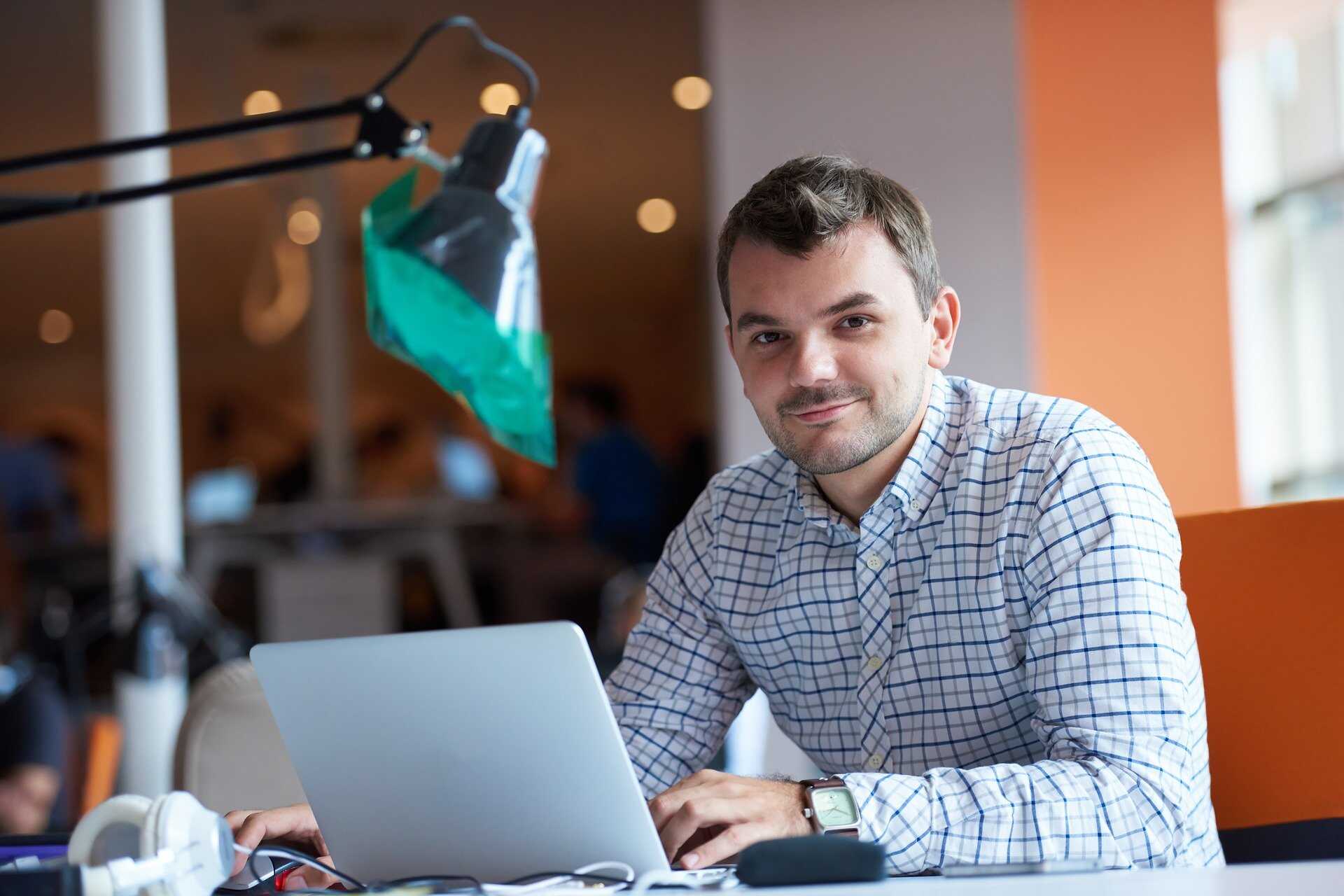 Male office worker with laptop