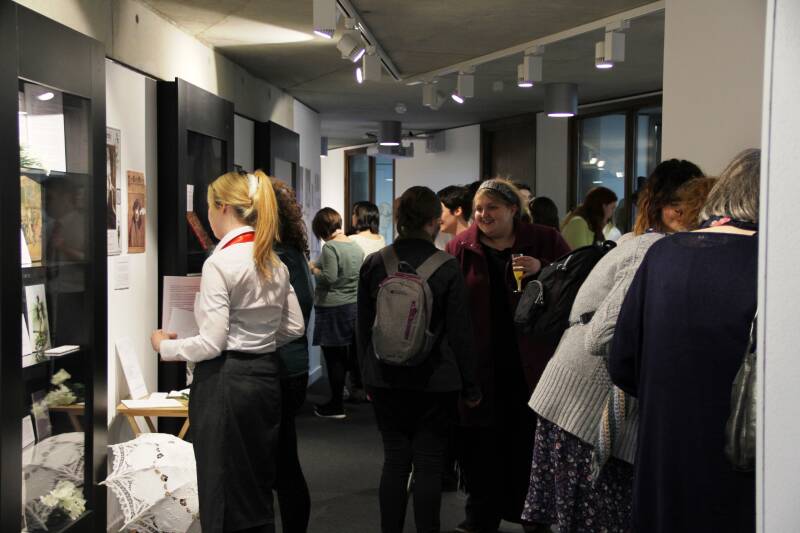 A photograph of visitors in the Special Collection and Archives gallery space during the opening of an exhibition in 2016.