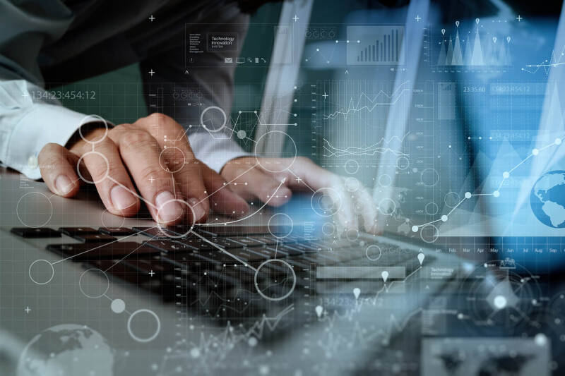 Digitally enhance image of person using computer keyboard with a graphic overlay.