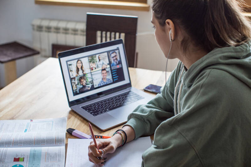 female student looking at laptop