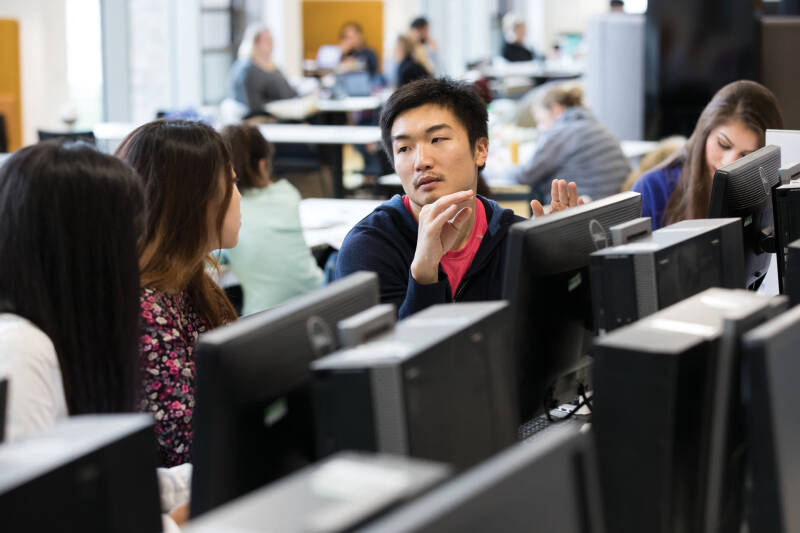 A group of students working at computers.