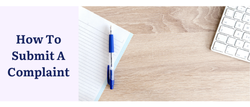 How to submit a complaint with a notebook, pen and keyboard in the background.
