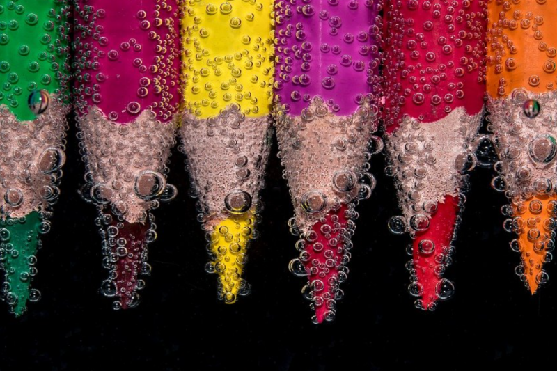 Coloured pencils under water