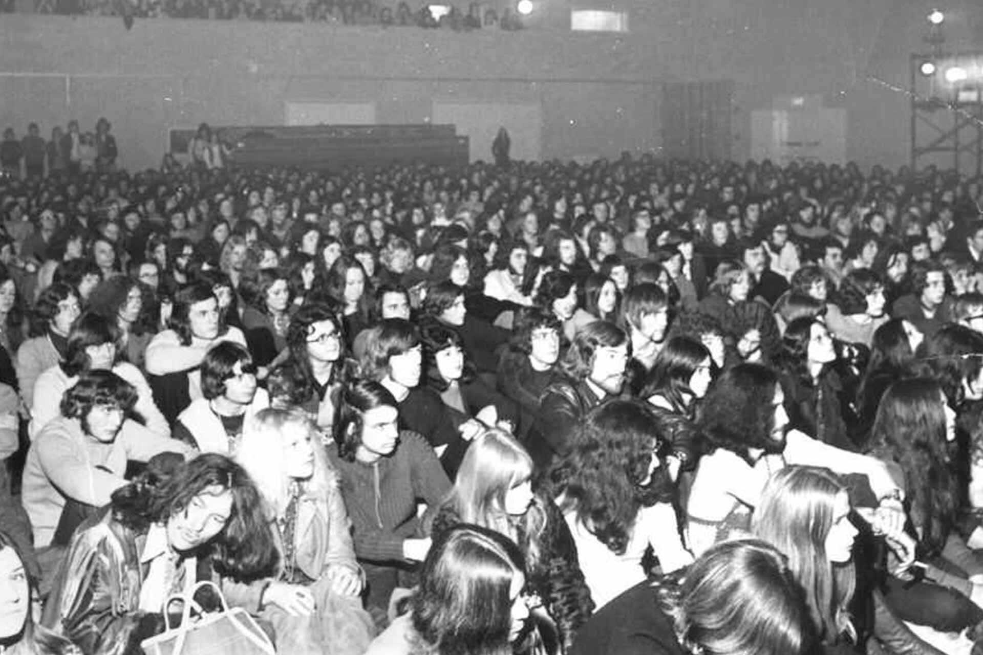 Students waiting in the Sports Hall for Led Zeppelin