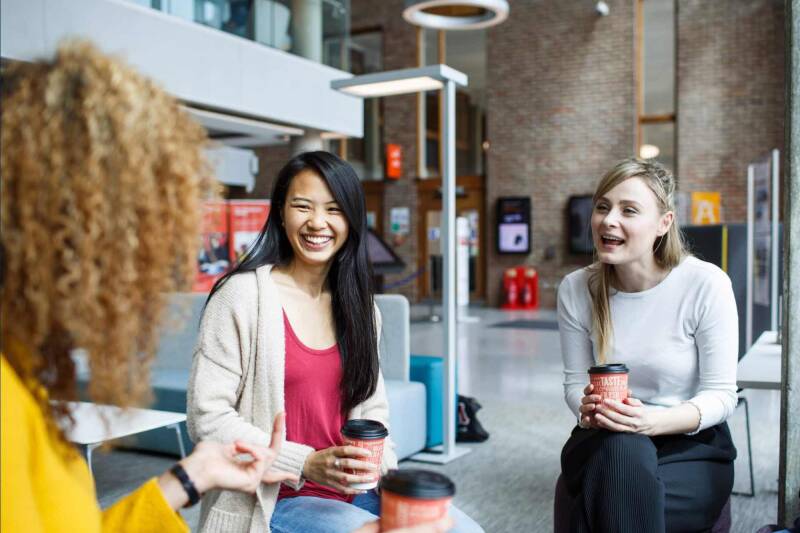 Students having coffee in a library