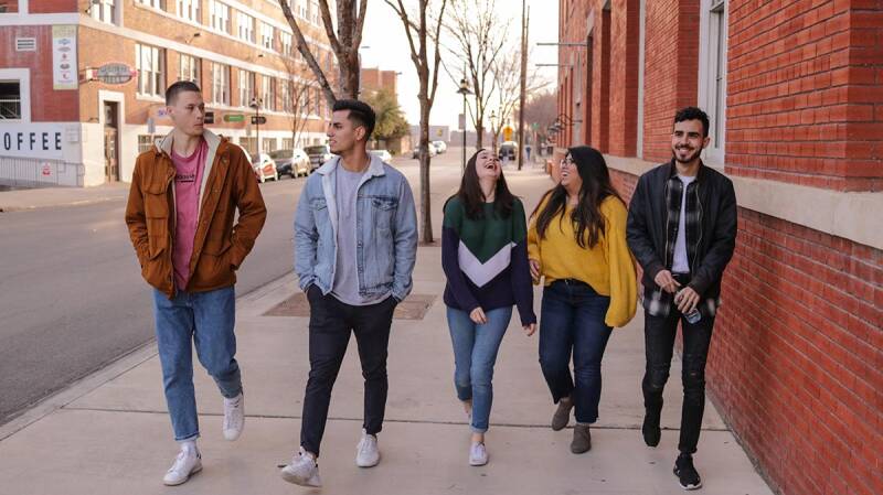 Group of students walking down the road