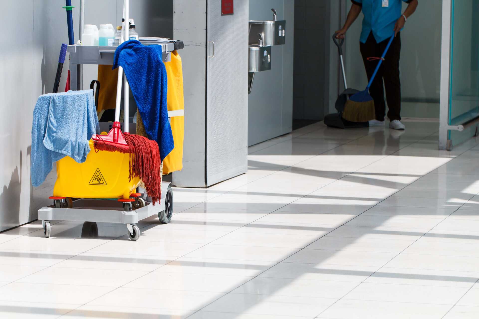 Cleaning equipment in tiled hallway