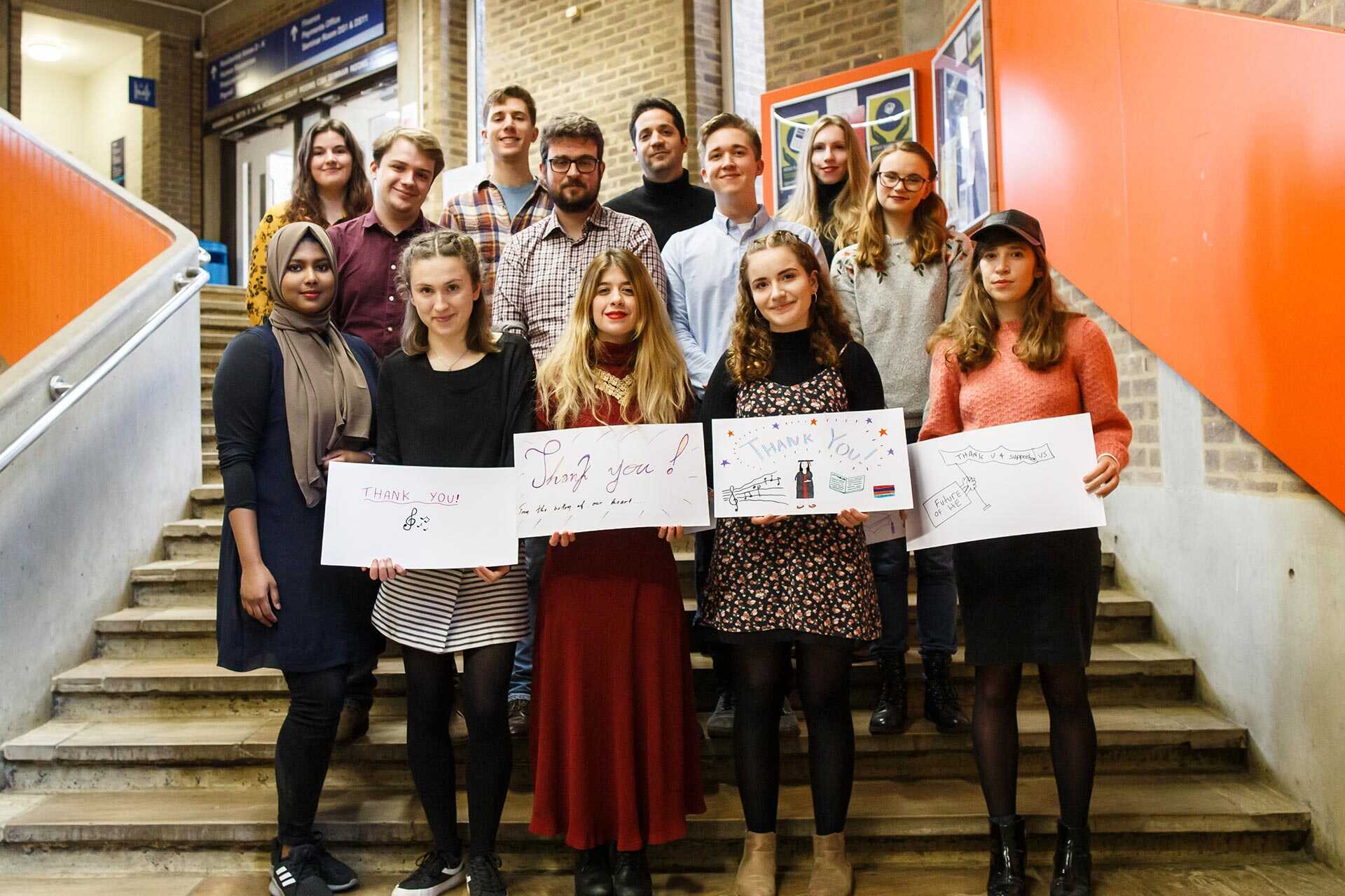 Kent scholars holding up thank you signs