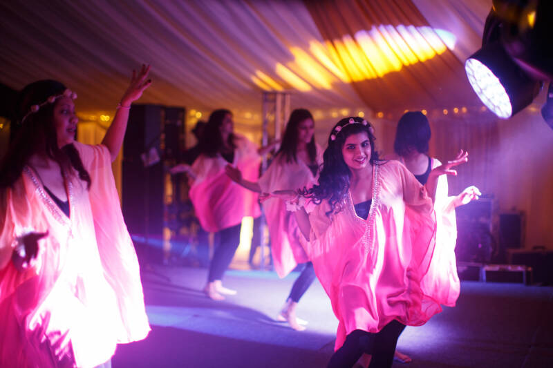 Image shows students from the Asian society dancing