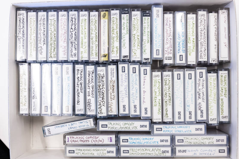 A box of DAT tapes in the John Pidgeon Collection. The box is open and the spine labels are visible.