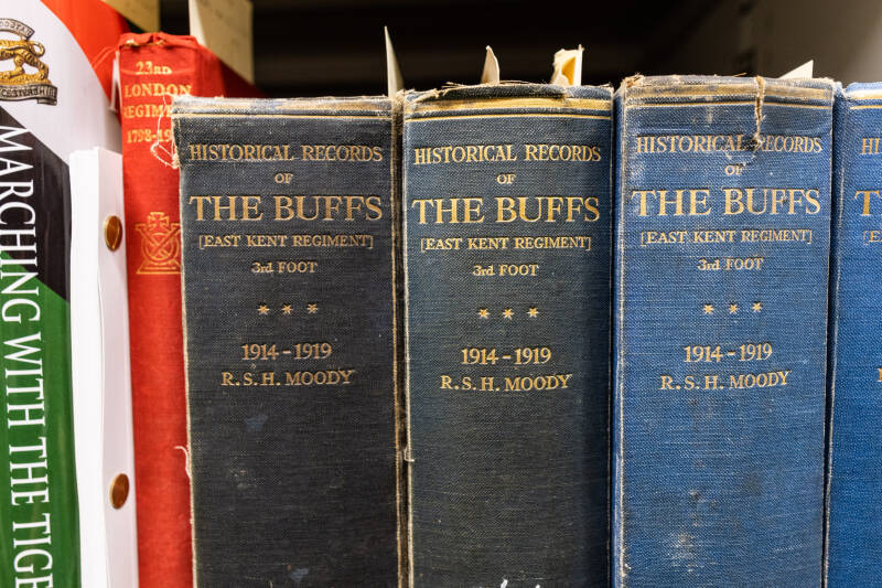 A close-up photograph of Buff volumes on a shelf.