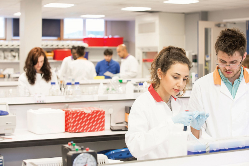 Male and female student working together in the lab