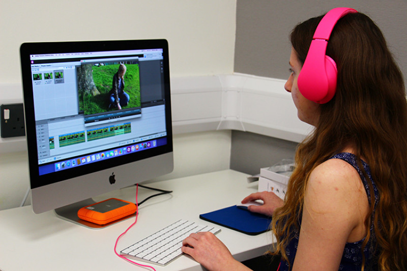 Female student editing a film