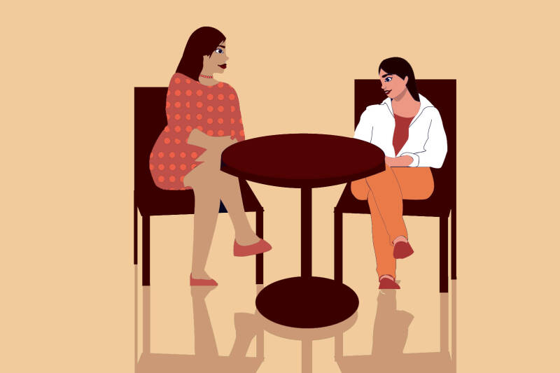 Cartoon in orange and red tones of two people sitting at a table talking.