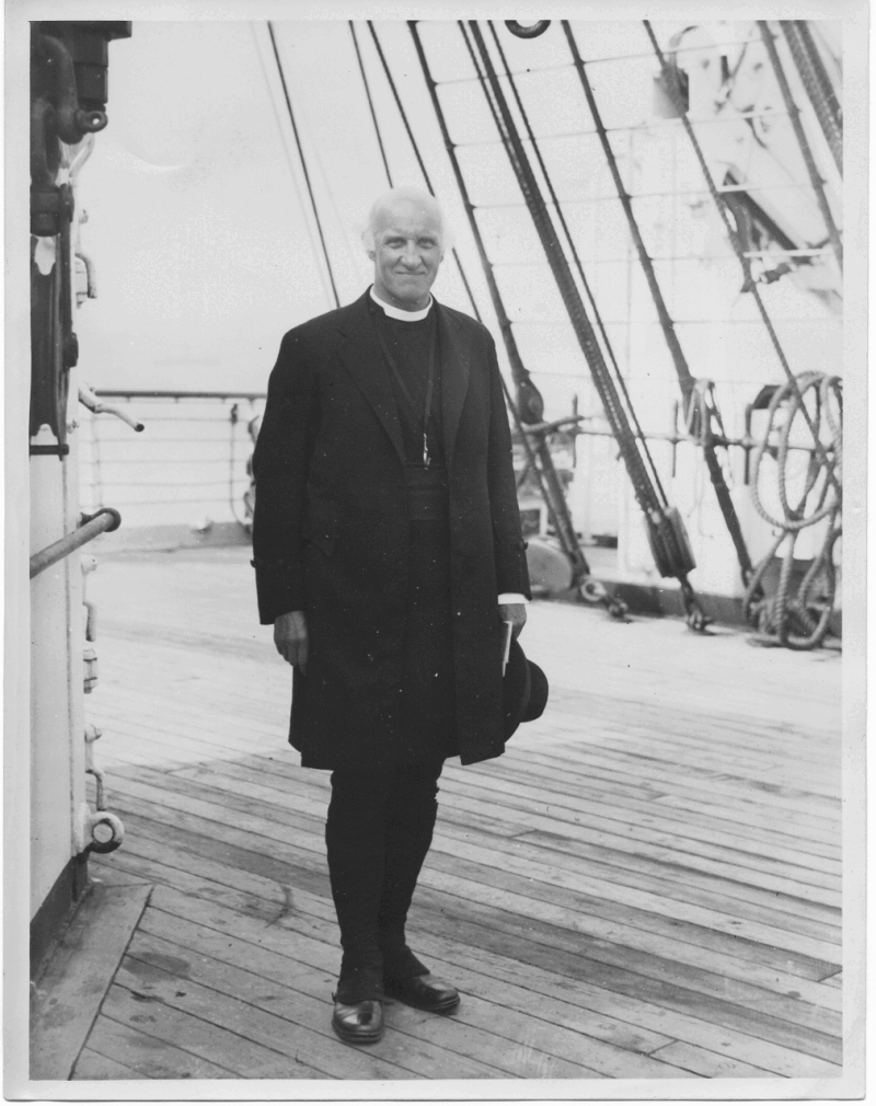 Black and white photograph of Hewlett Johnson standing on what appears to be a ship (undated)