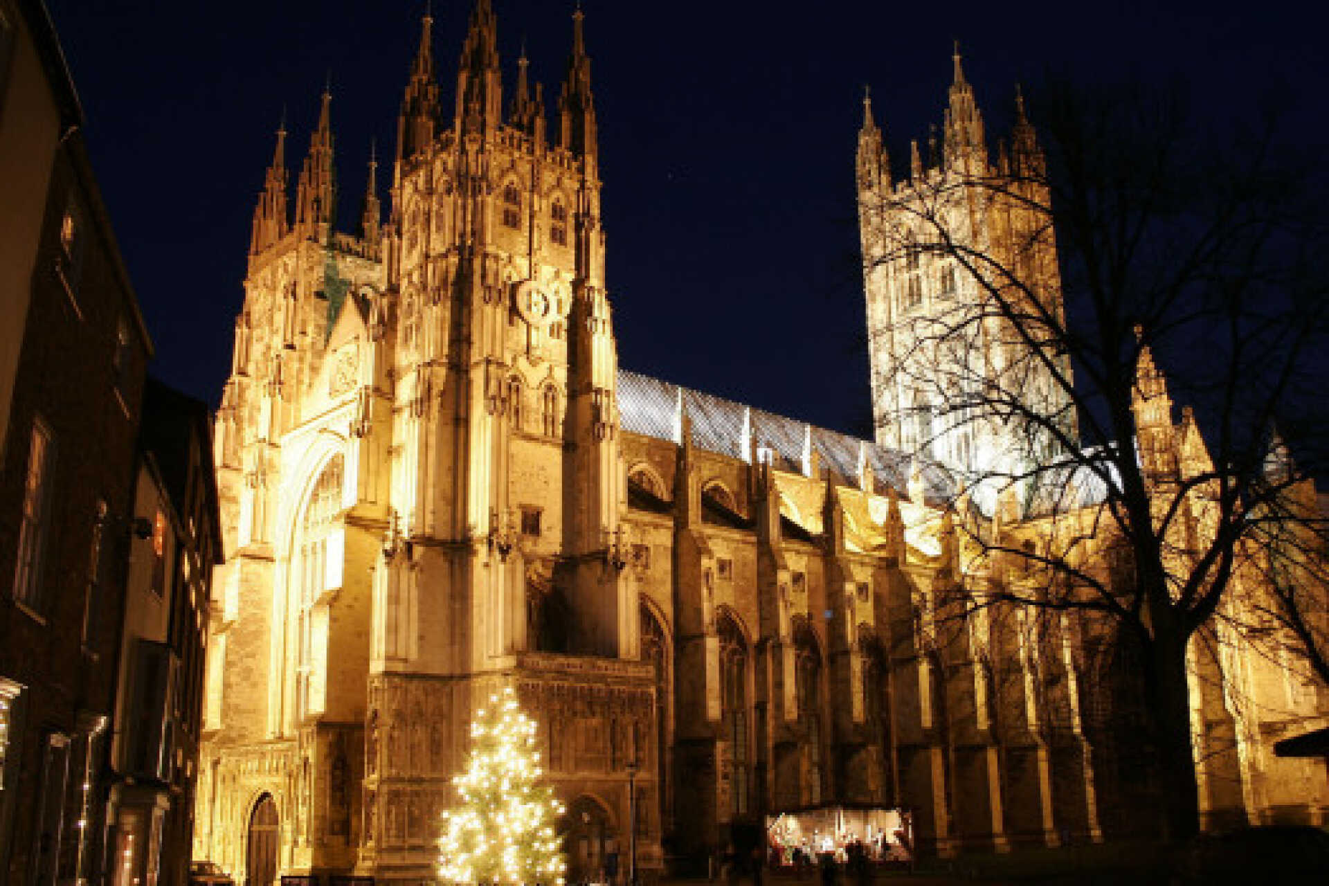 Canterbury cathedral lit against a night sky