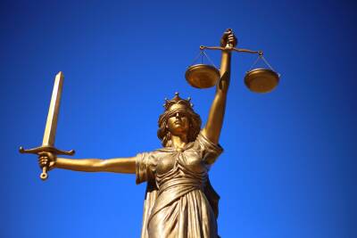 Lady justice holding a sword and a set of scales