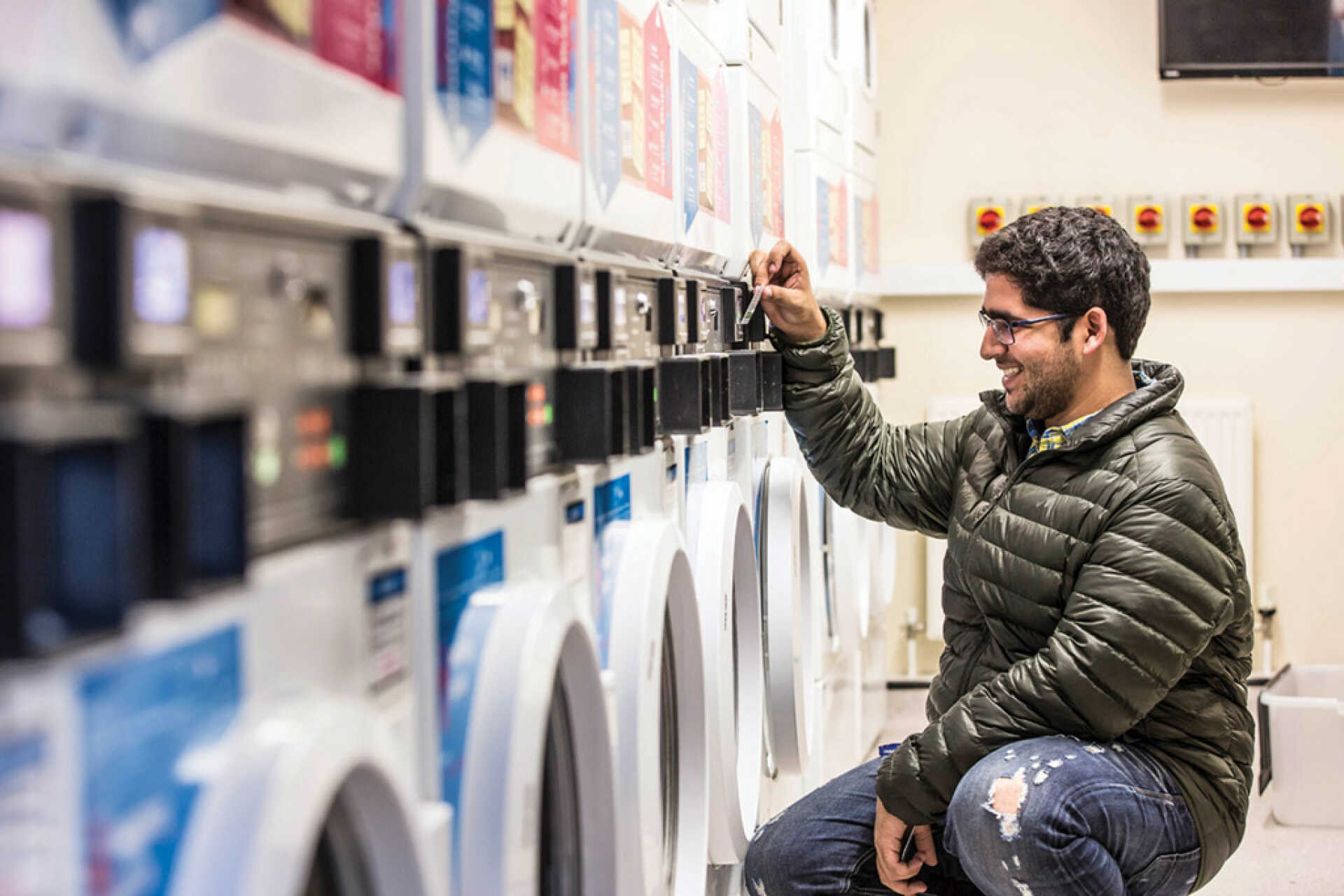 Male student using laundry