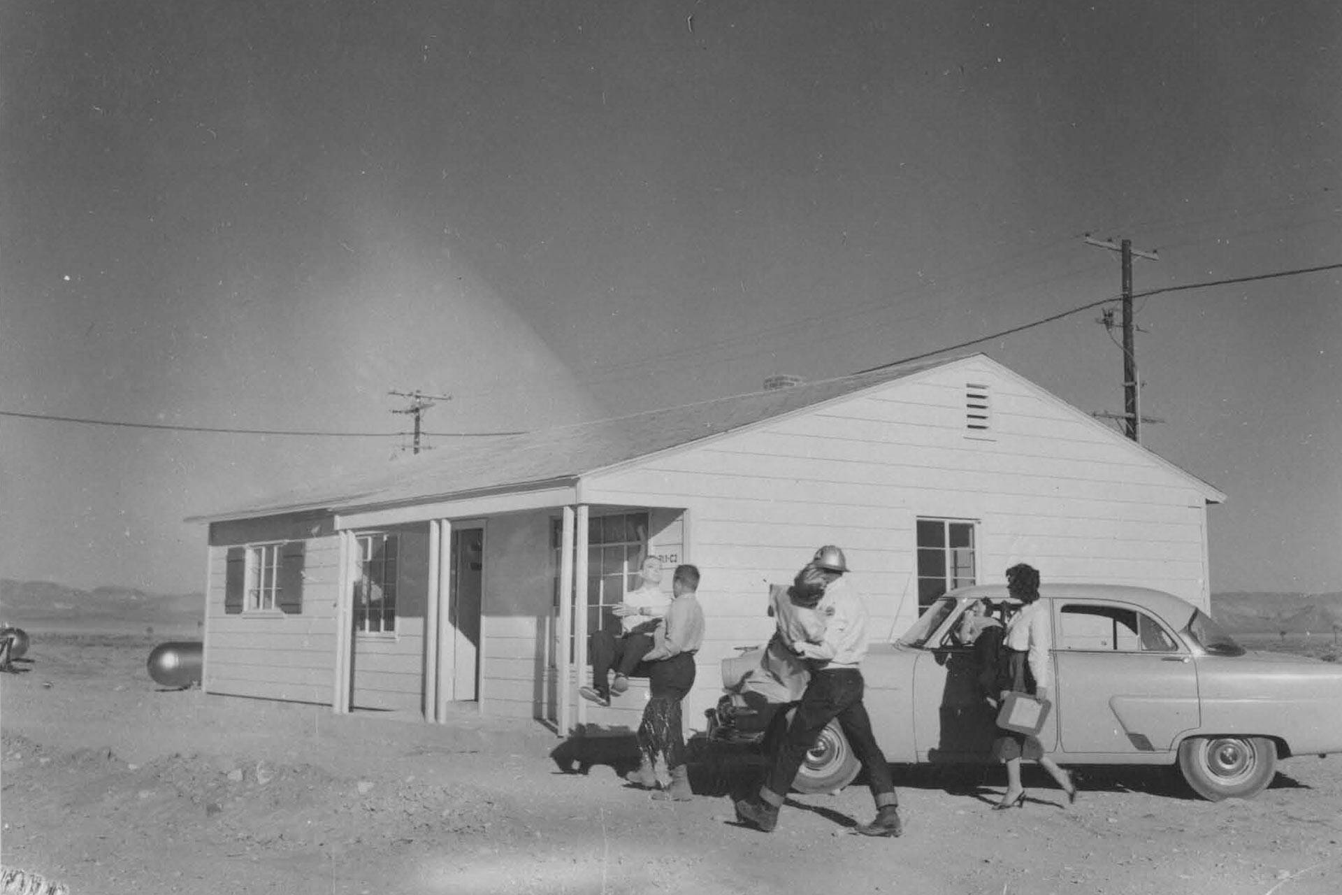 People moving mannequins into a house in the Nevada desert