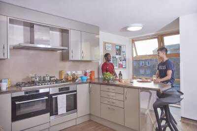 Two male students talking in a Park Wood Flat kitchen