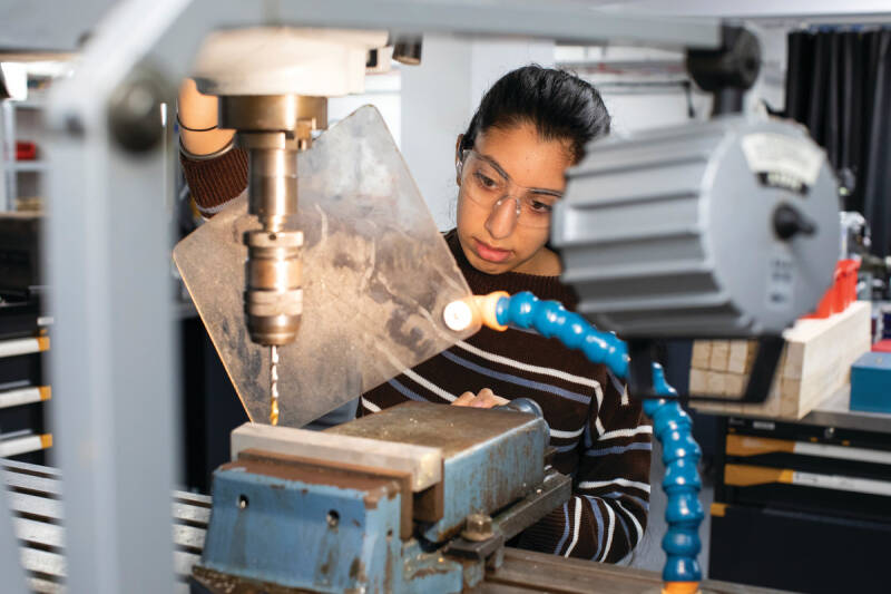 Student working with lathe