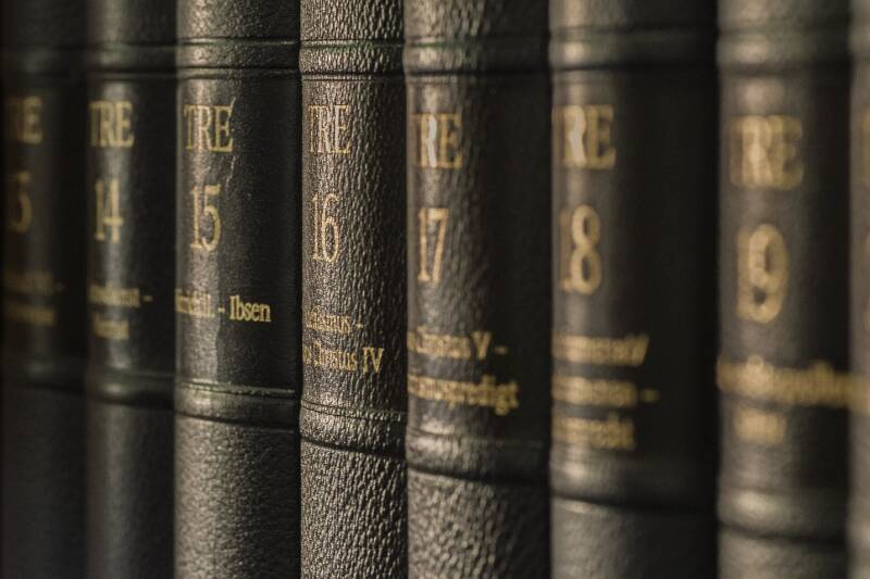 A row of bibles on a shelf