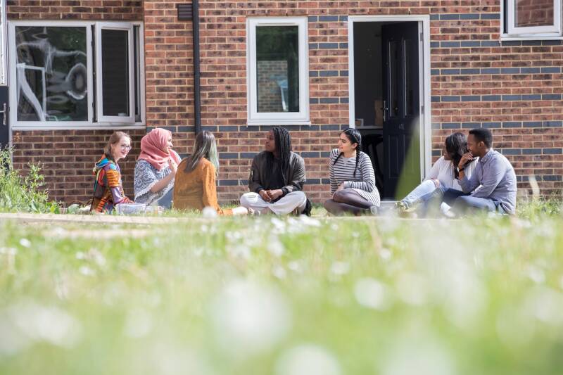 Students sitting outside Park Wood Houses